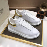 Alexander McQueen sneakers suola oversize bianco oro
