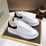 Alexander McQueen sneakers suola oversize bianco nero