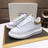 Alexander McQueen sneakers suola oversize bianco oro