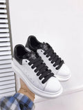 Alexander McQueen sneakers suola oversize bianco inserti neri