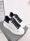 Alexander McQueen sneakers suola oversize bianco inserti neri