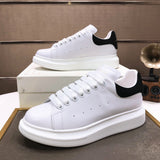 Alexander McQueen sneakers suola oversize bianco nero