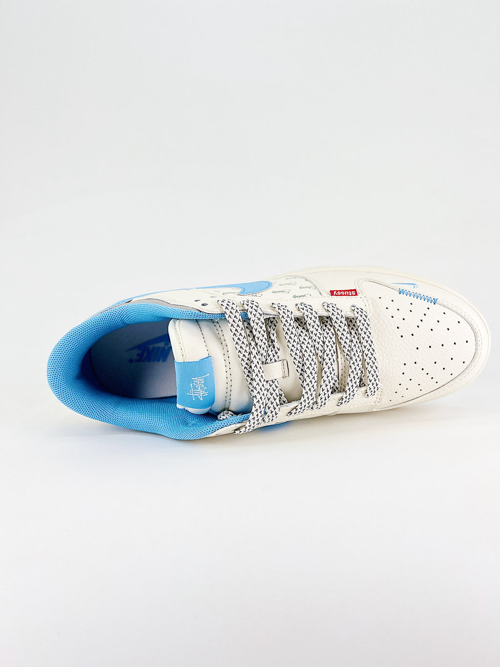 Nike New Dunk SB Low mod. Stussy celeste