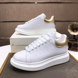 Alexander McQueen sneakers suola oversize bianco oro