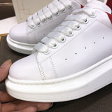 Alexander McQueen sneakers suola oversize bianco rosso