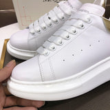 Alexander McQueen sneakers suola oversize bianco oro